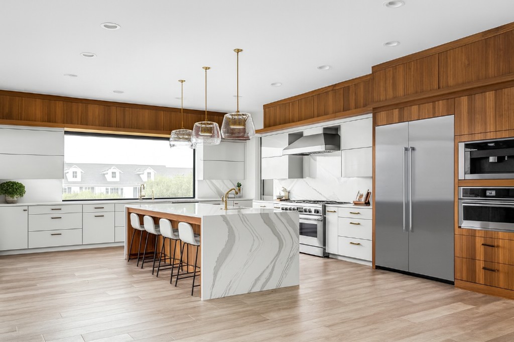 Premium renovated kitchen with coordinated cabinetry, island, countertops, lighting, and finishes