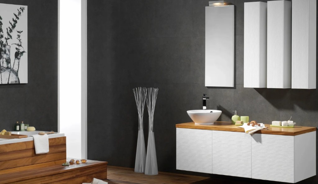 Contemporary bathroom with floating textured vanity, wood countertop, vessel sink, and dark gray tile walls
