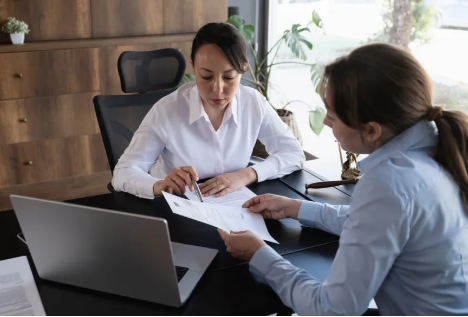 Professional reviewing a technical summary document with a client